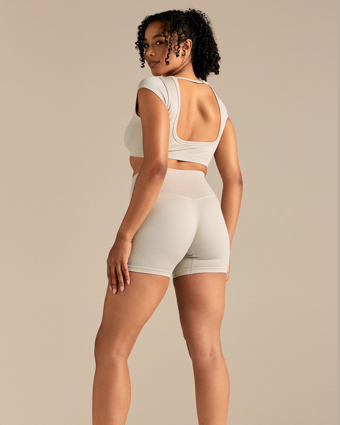 Motion Seamless Open Back Short Sleeve Crop Top | Stone
