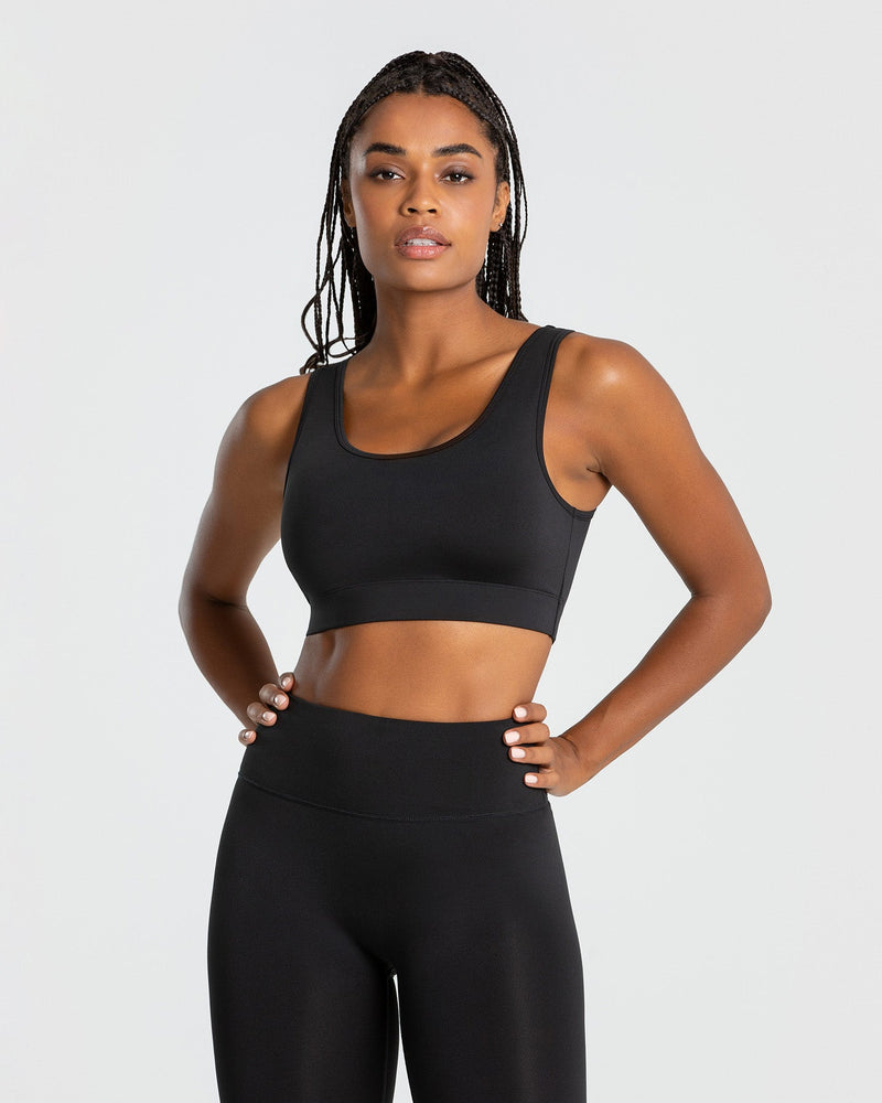 500 Women's Fitness Cardio Training Sports Bra - Black  A comfortable  sports bra that you won't be able to live without thanks to its cross-over  straps at the back, the mesh